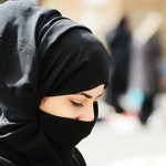 Saudi Arabian woman in prayer.