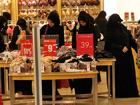 Group of Saudi women shopping at a high-end mall.