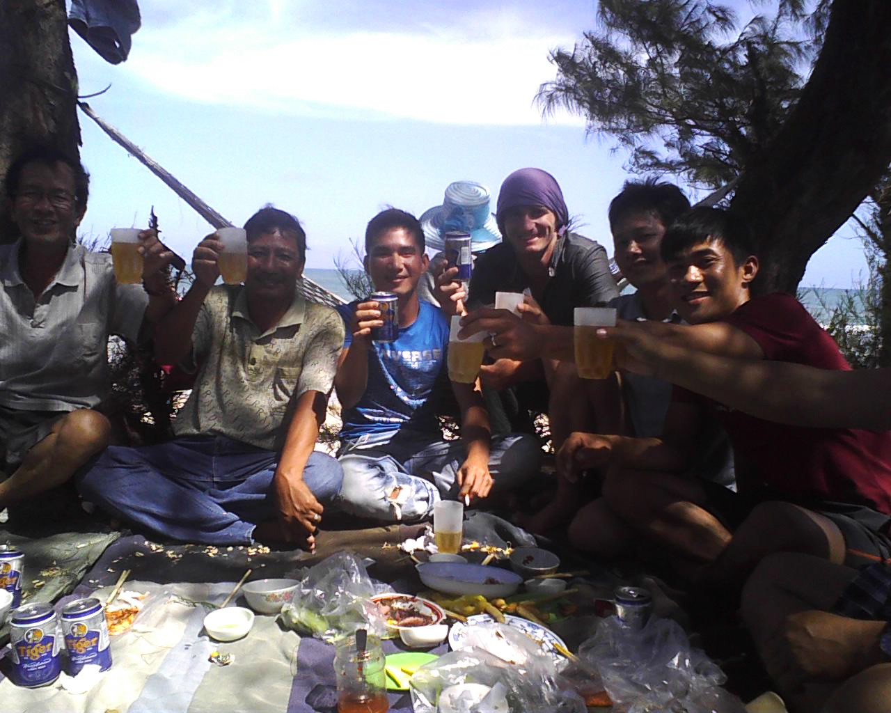 Toasting with locals in Central Vietnam.