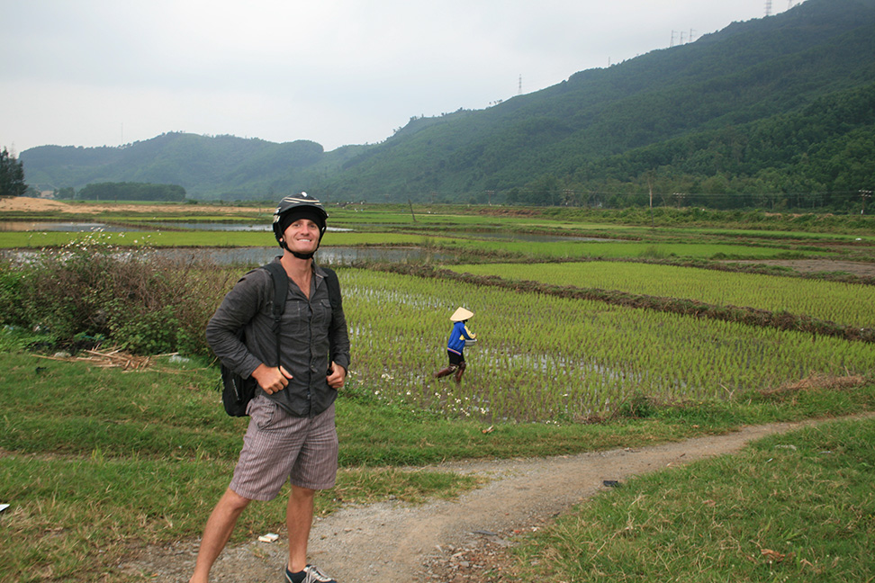 Standing in front of a rice paddy in rural Vietnam.