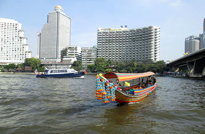 Traveling by ferry on the Chao Phraya River, Bangkok.