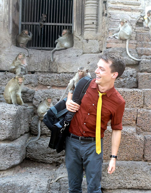 Gregory Diehl playing with monkeys.