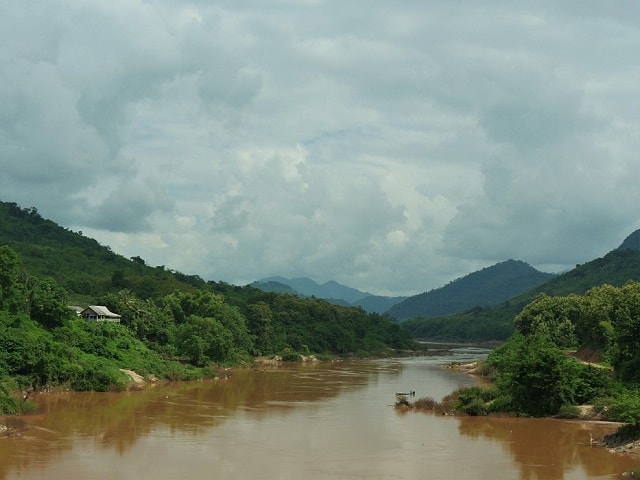 Gregoire Mevel crossing the Nam Ou river in Northern Laos. 